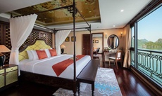 A bed or beds in a room at Indochine Cruise