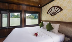 A bed or beds in a room at Garden Bay Premium Cruise