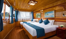 A bed or beds in a room at La Paci Cruises