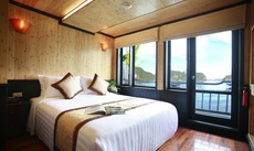 A bed or beds in a room at Syrena Cruises