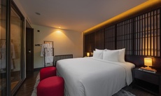 A bed or beds in a room at Scarlet Pearl Cruises