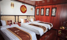 A bed or beds in a room at Viola Cruise Halong Bay