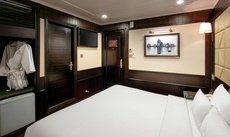 A bed or beds in a room at Pelican Halong Cruise