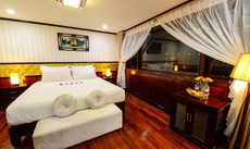 A bed or beds in a room at Halong Silversea Cruise