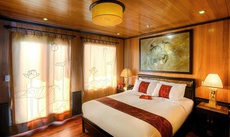 A bed or beds in a room at Indochina Sails Cruise